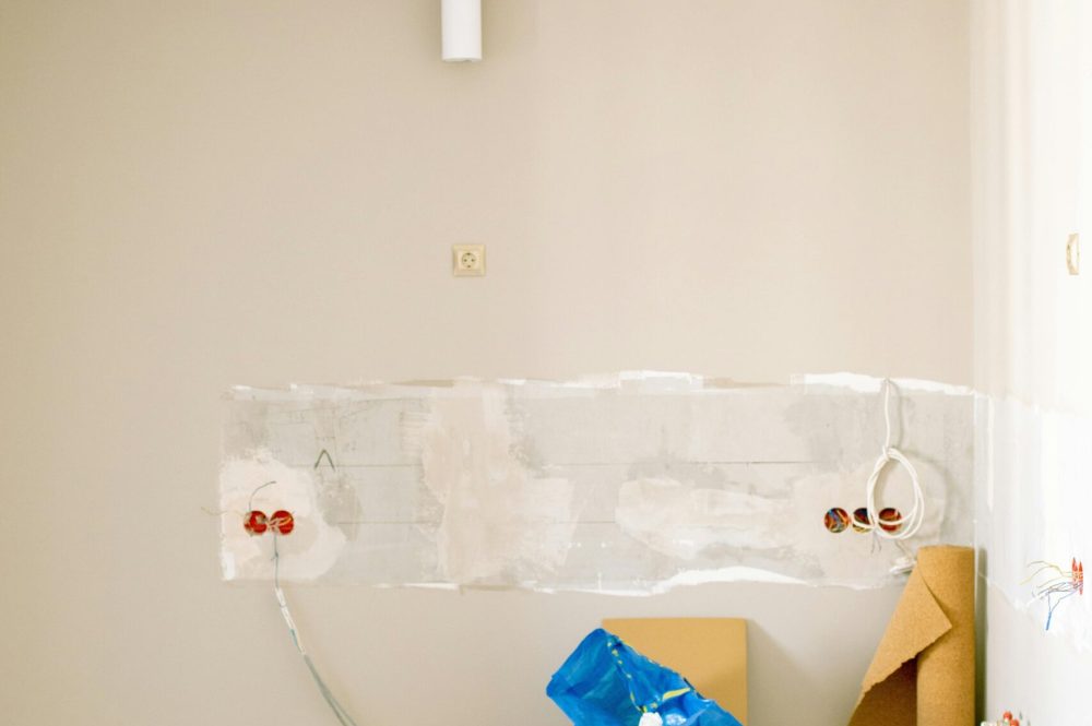 pexels photo 3615725 3615725 An indoor scene showing a messy home renovation project with tools, paint, and materials scattered around.